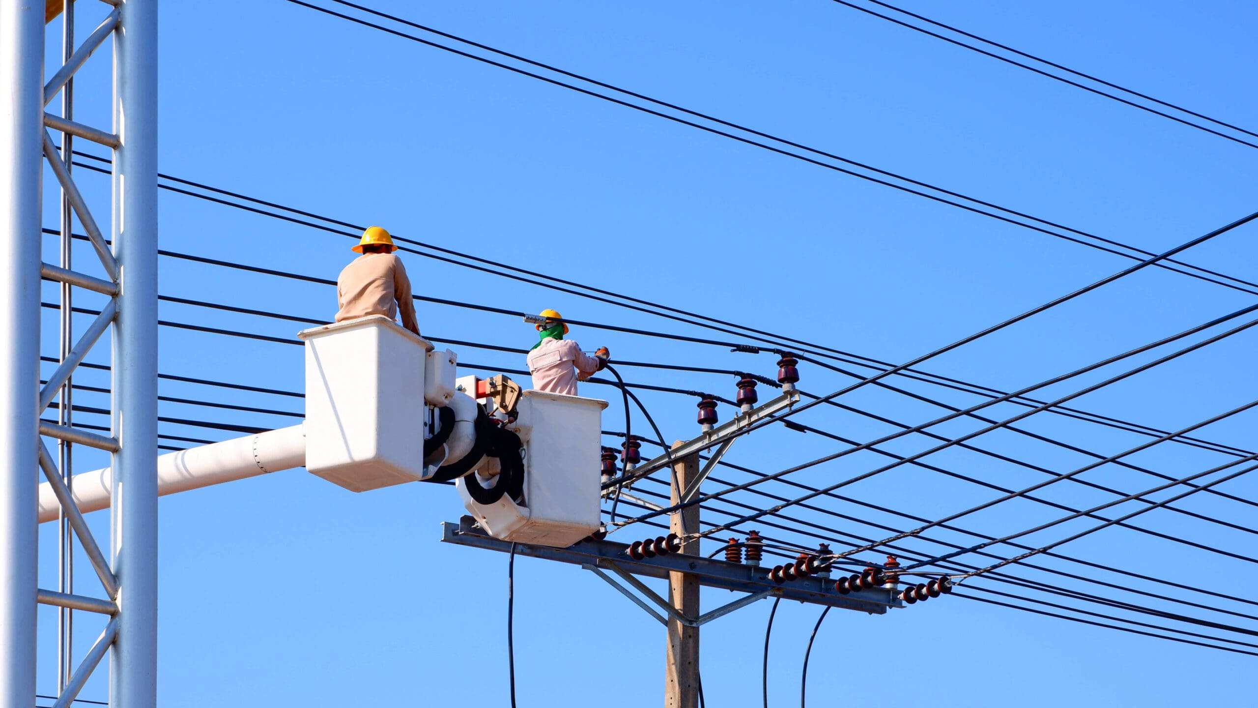 two electricians on bucket boom truck installing e 2023 11 27 05 02 40 utc