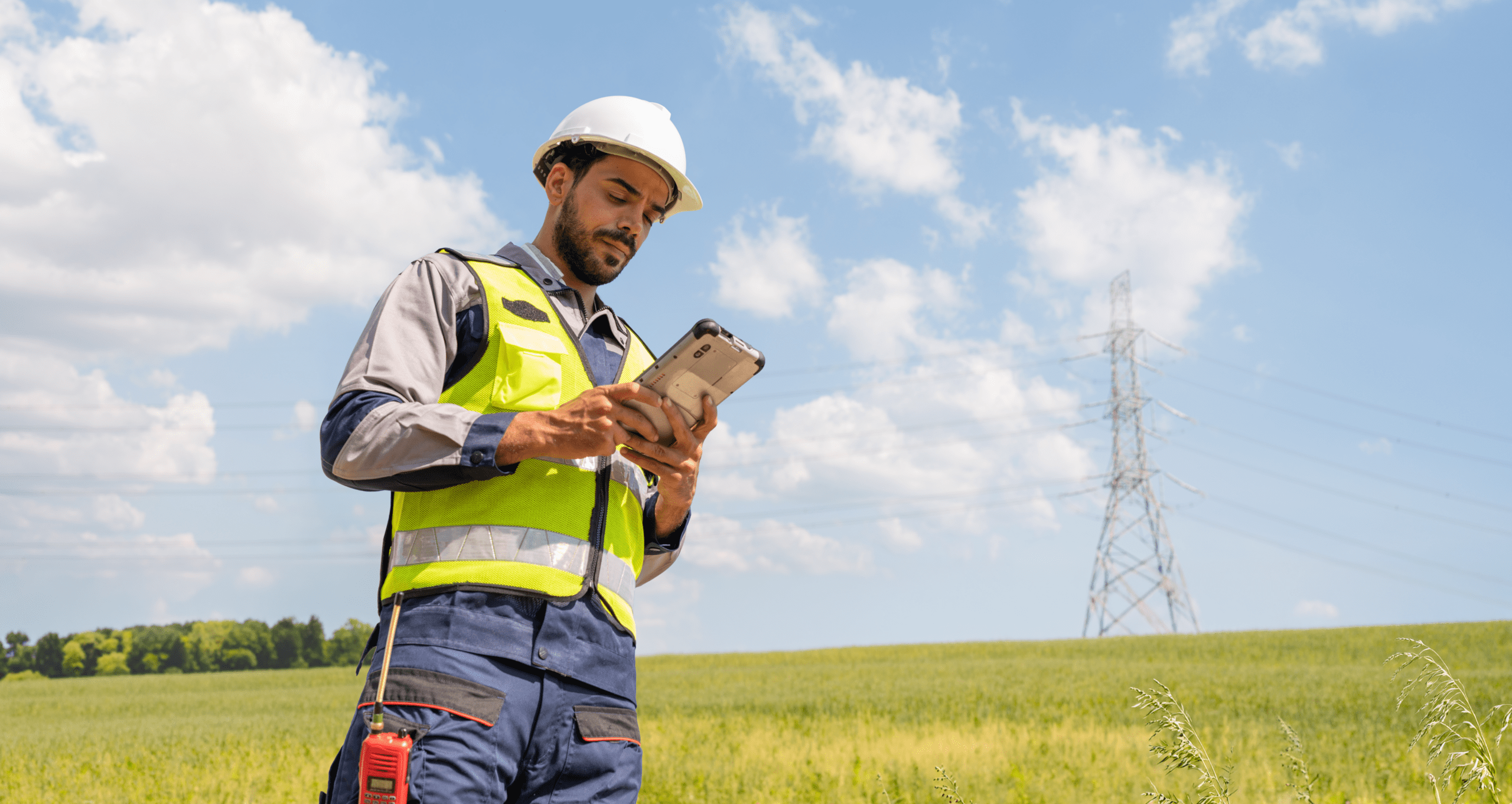field worker inspects power in remote area with tablet