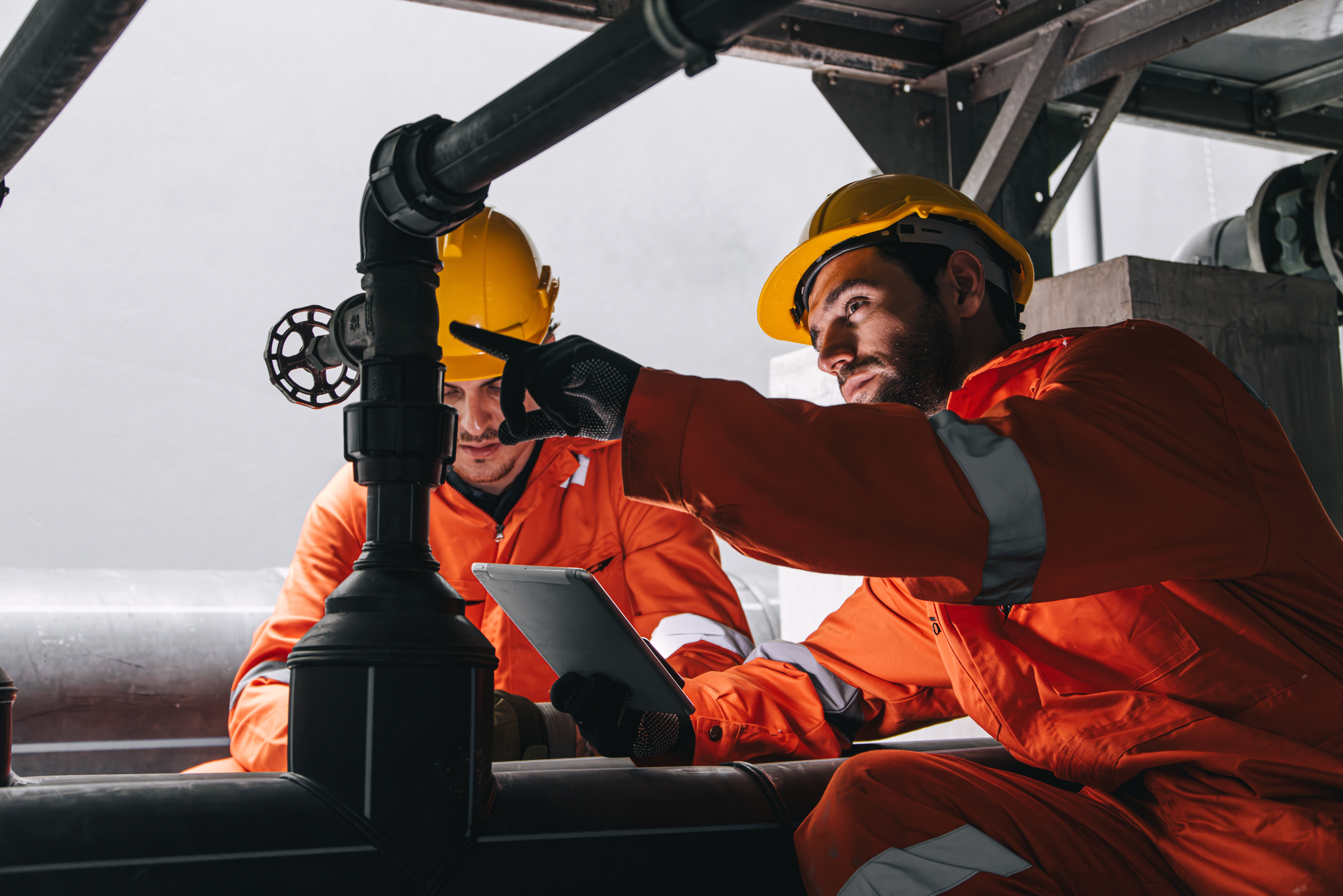 Two professional engineers performing service maintenance with EpochField Mobile