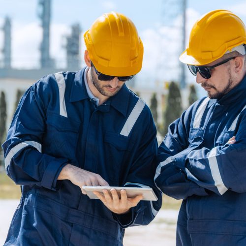 Engineer teamwork, workers working survey inspection with epochfield at petroleum refinery